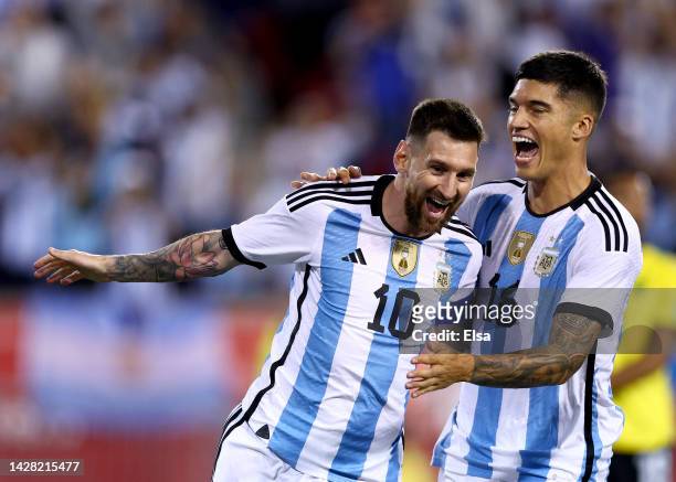 Lionel Messi of Argentina celebrates his goal with teammate Joaquin Correa in the second half against Jamaica at Red Bull Arena on September 27, 2022...