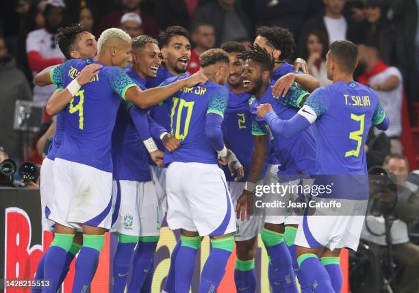 Neymar Jr of Brazil celebrates his goal on a penalty kick with teammates during the international friendly football match between Brazil and Tunisia...