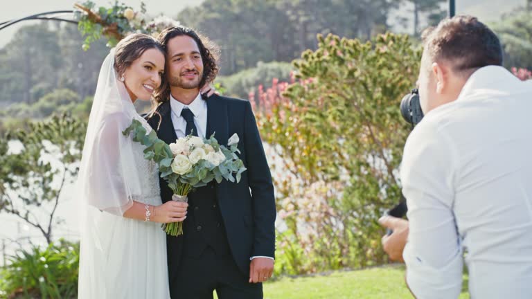 https://media.gettyimages.com/id/1428229999/video/marriage-wedding-photographer-and-couple-pose-together-for-cute-and-loving-relationship.jpg?b=1&s=640x640&k=20&c=Cc_pMRl4BKWBSRJ94SG53Y8ojOt8mNLpjo6qUTnJ5UM=