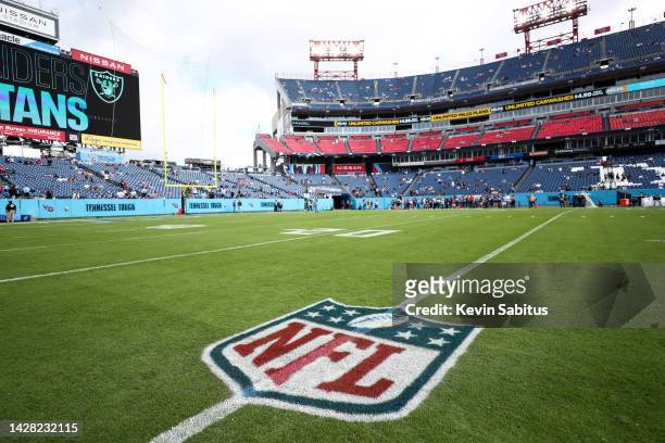 Detail shot of an NFL shield logo painted on the field prior to an NFL football game between the Las Vegas Raiders and Tennessee Titans at Nissan...