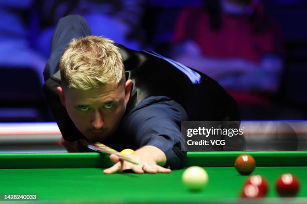 Kyren Wilson of England plays a shot in the first round match against Barry Hawkins of England on day one of the 2022 Cazoo British Open at Marshall...