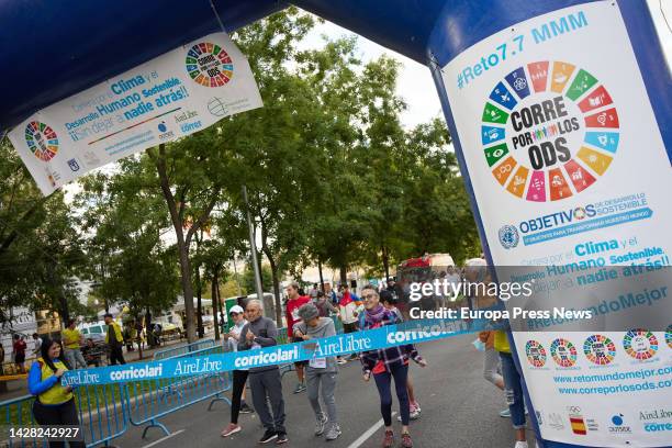 Several people wait at the start to participate in a race to raise awareness of the 17 Sustainable Development Goals, on Paseo de la Castellana, on...