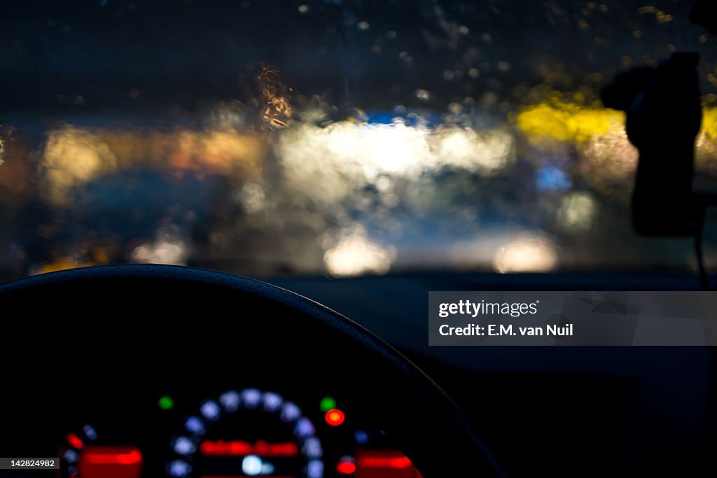 View of car from inside driving in rains