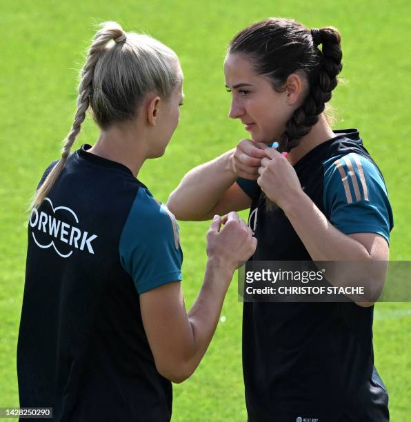 Germany's Merle Frohms and Sara Daebritz talk together prior the training session of the German women national soccer team during the training camp...