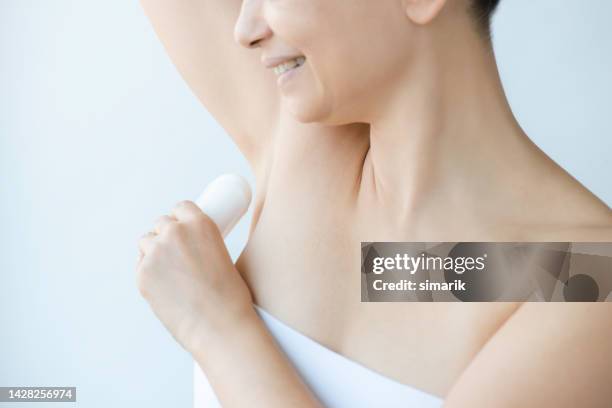 using antiperspirant - body odour stock pictures, royalty-free photos & images