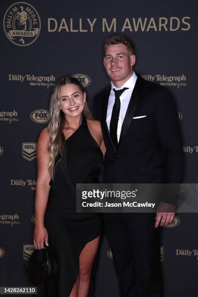 Matt Burton of the Bulldogs and his partner Zoe Warwick arrive ahead of the 2022 Dally M Awards at The Winx Stand, Royal Randwick Racecourse on...