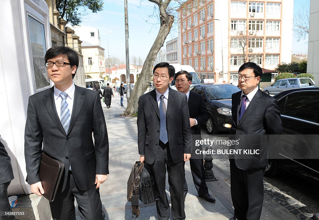 Members of the Chinese delegation arrive