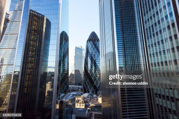 futuristic financial buildings london business district - city of london stock pictures, royalty-free photos & images