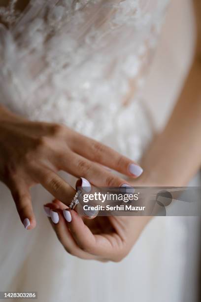 bride's hands - stock photo - promesas de matrimonio fotografías e imágenes de stock