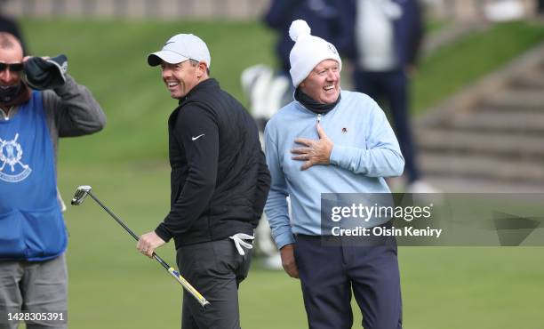 Rory McIlroy of Northern Ireland with his father, Gerry McIlroy on the 18th hole during a practice round prior to the Alfred Dunhill Links...