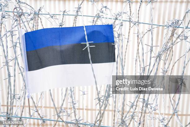 flag of the republic of estonia.on barbed wire - estoniaon stock pictures, royalty-free photos & images