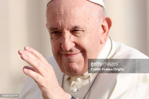 Pope Francis waves to the faithful as he arrives at St Peter's Square for his Wednesday General Audience on September 28, 2022 in Vatican City,...