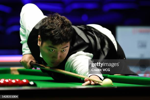 Yan Bingtao of China plays a shot in the first round match against Andy Lee of Hong Kong on day three of the 2022 Cazoo British Open at Marshall...