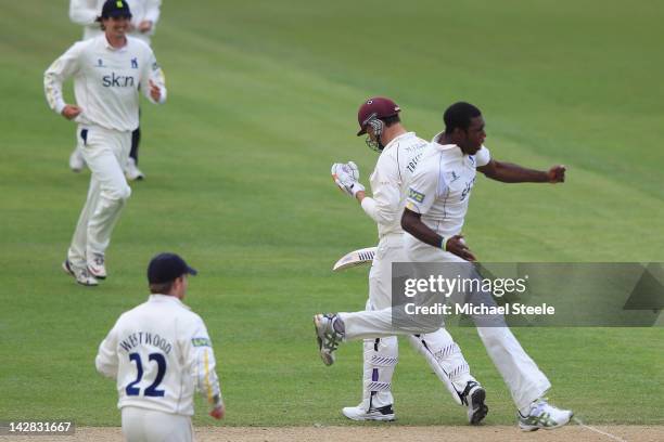 Keith Barker of Warwickshire celebrates capturing the lbw wicket of Marcus Trescothick of Somerset during day two of the LV County Championship...