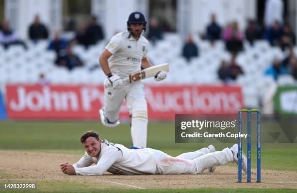 Liam Patterson-White of Nottinghamshire reacts after misfielding during the LV= Insurance County Championship match between Nottinghamshire and...