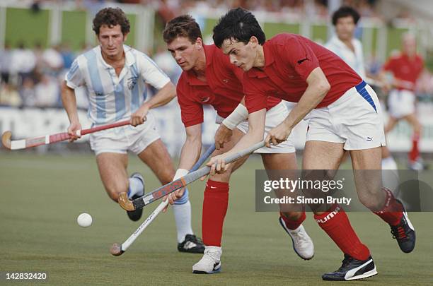 John Shaw and Martyn Grimley of England in action against Argentina during their Pool A match at the 6th FIH Men's Field Hockey World Cup on 6th...