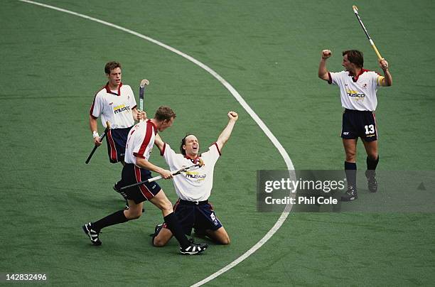 Calum Giles of England celebrates a goal with team mates Jonathan Wyatt, Russell Garcia and Mark Pearn during their 2-1 defeat of Canada at the 9th...