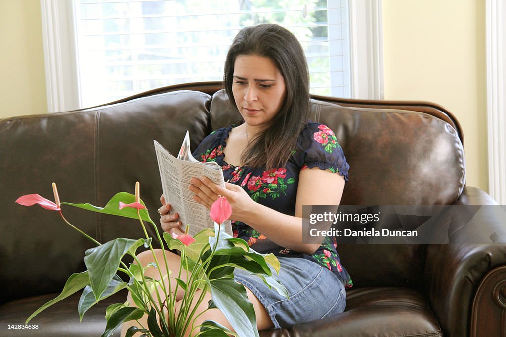 Woman reading magazine