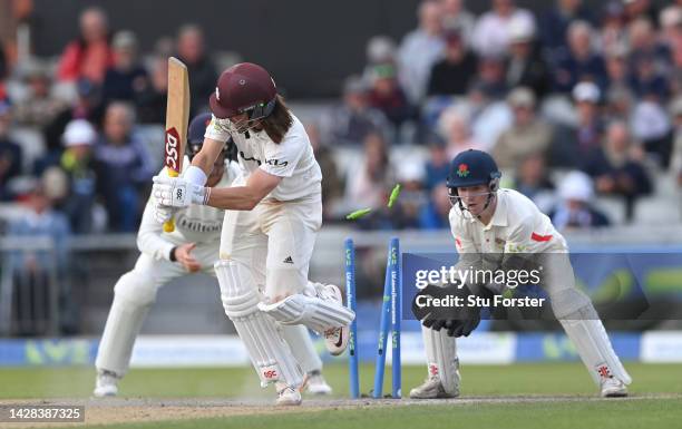 Surrey batsman Rory Burns is bowled by Tom Hartley for 61 runs watched by wicketkeeper George Bell during the third day of the LV= Insurance County...