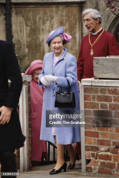Queen Elizabeth II and the Queen Mother attend the Easter service at St George's Chapel, Windsor, circa 1987. They are accompanied by the Dean of...