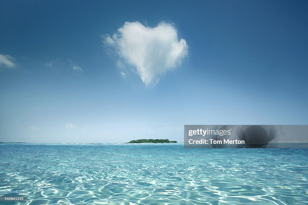 Heart shaped cloud over tropical waters
