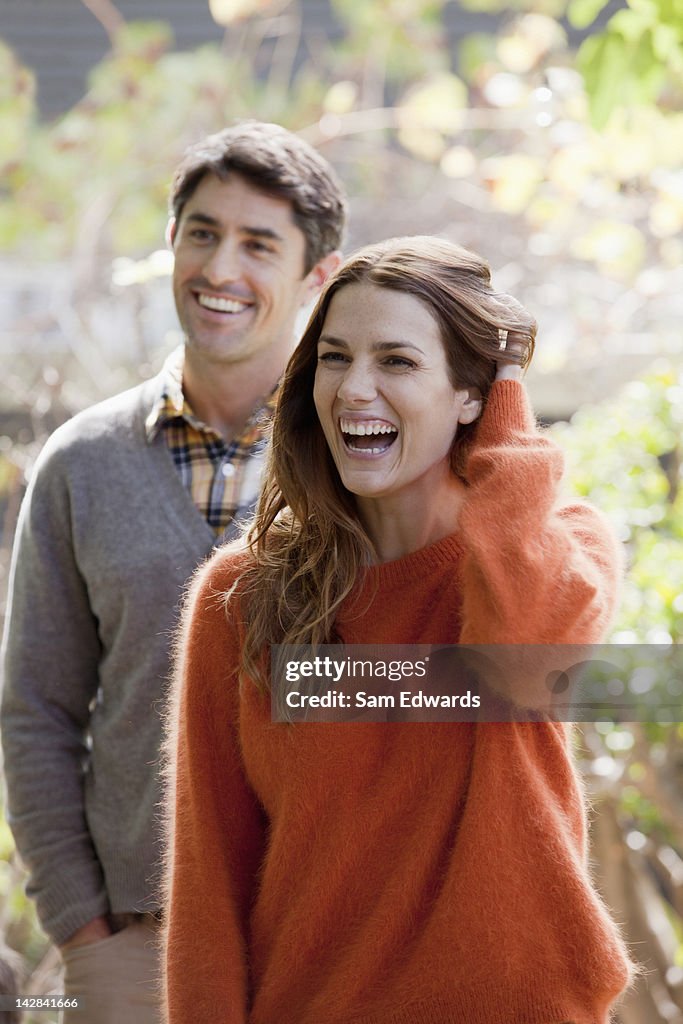 Smiling couple standing outdoors
