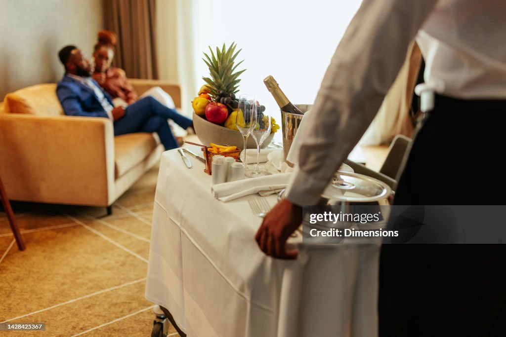 Wealthy couple being catered.