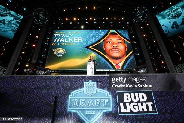 Commissioner Roger Goodell of the NFL presents the number one pick in the NFL football draft to the Jacksonville Jaguars during round one of the 2022...