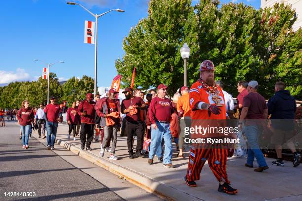 Fans gather outside of Lane Stadium prior to the college football game between the Virginia Tech Hokies and the West Virginia Mountaineers on...