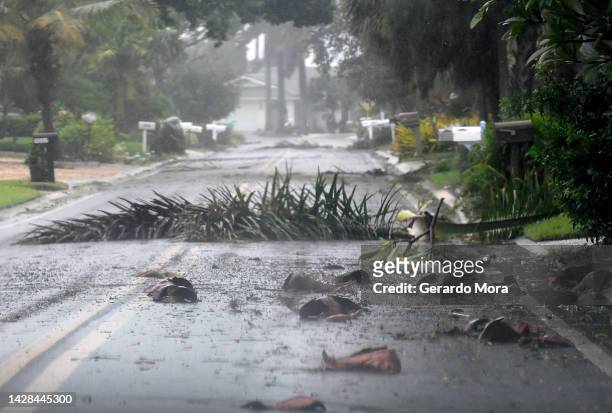 Debris litters a street in a neighborhood of St. Pete Beach as the winds from Hurricane Ian arrive on September 28, 2022 in St. Petersburg, Florida....