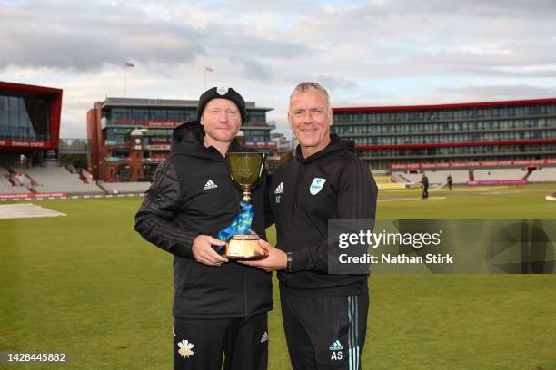 Surrey coach Gareth Batty and Alec Stewart of Surrey poses with the LV= Insurance County Championship Trophy after the match between Lancashire and...