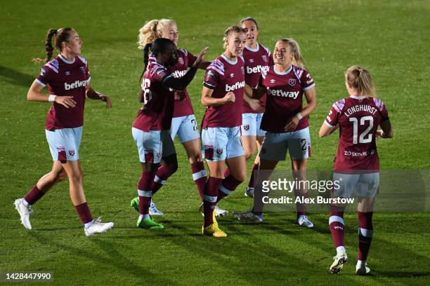 Dagny Brynjarsdottir of West Ham United celebrates with teammates after scoring their team's first goal during the FA Women's Super League match...