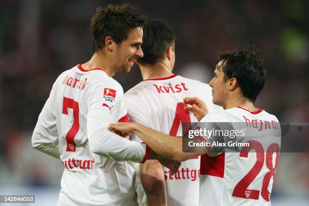 Martin Harnik of Stuttgart celebrates his team's second goal with team mates William Kvist and Tamas Hajnal during the Bundesliga match between VfB...