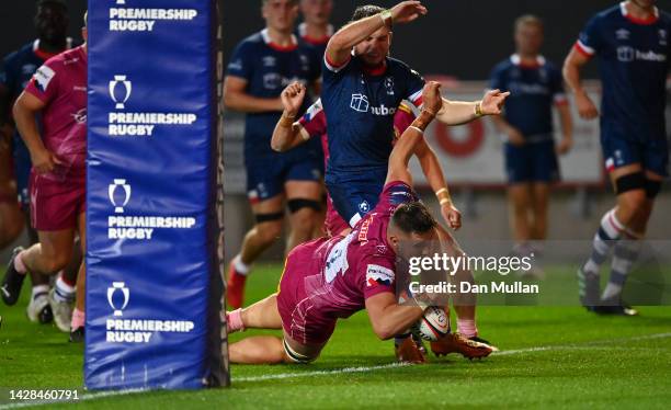 Lewis Pearson of Exeter Chiefs dives over to score his side's third try during the Premiership Rugby Cup match between Bristol Bears and Exeter...