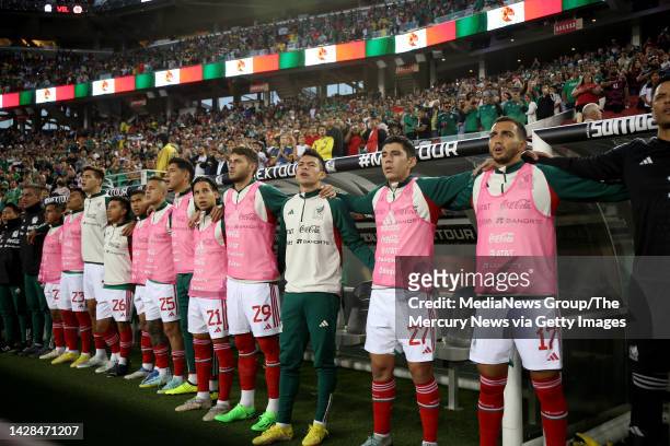 The Mexico National team bench sign the national anthem before the start of the friendly soccer match against Colombia at Levi's Stadium in Santa...