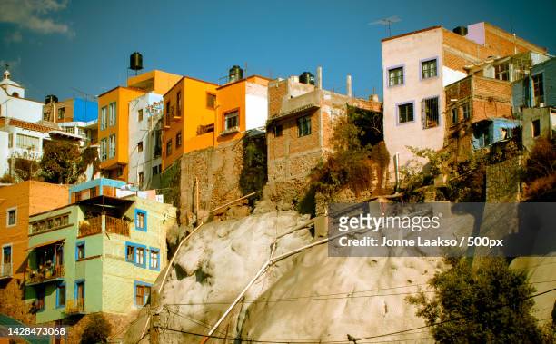 low angle view of buildings against sky,guanajuato,mexico - central mexico ストックフォトと画像