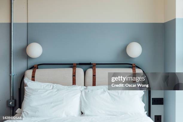 a cozy and stylish bed in the bedroom - headboard stock pictures, royalty-free photos & images