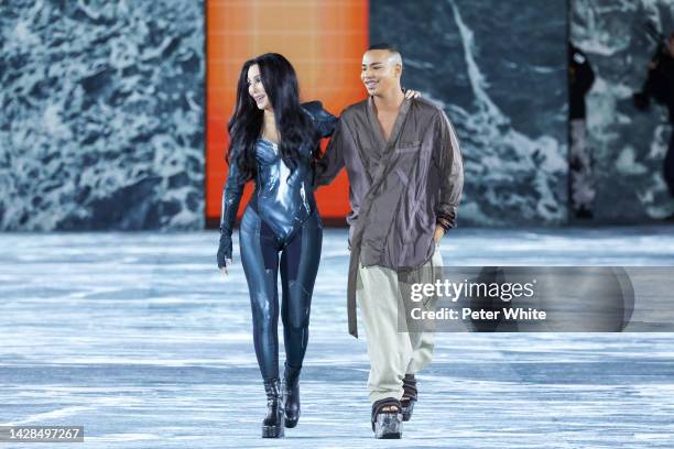 American singer Cher walks next to French fashion designer Olivier Rousteing on the runway at the Balmain Womenswear Spring/Summer 2023 show as part...