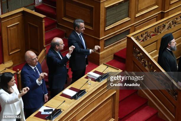 Newly elected Greek Prime Minister Kyriakos Mitsotakis and his government swear during the swearing-in ceremony at the Greek parliament in Athens,...