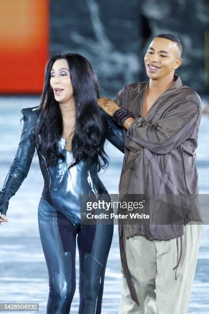 Singer Cher walks next to French fashion designer Olivier Rousteing walks the runway during the Balmain Womenswear Spring/Summer 2023 show as part of...