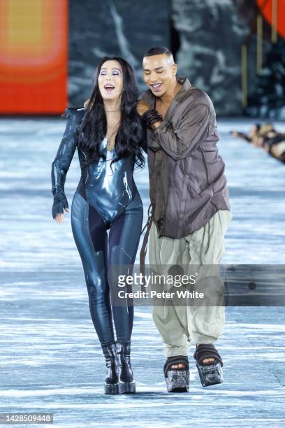 American singer Cher walks next to French fashion designer Olivier Rousteing on the runway at the Balmain Womenswear Spring/Summer 2023 show as part...