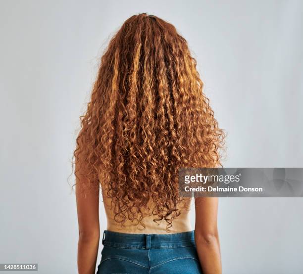 natural, healthy hair of woman show growth, texture and health in studio. female from brazil with wave hairstyle extension, weave or curly textures in a beauty salon perm style with white background - shiny wavy hair stock pictures, royalty-free photos & images