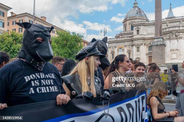 Gay Pride Parade passing by Saint Mary Major Basilica church . "Bondage is not a crime" written on a black t-shirt. Gay LGBT community, people...