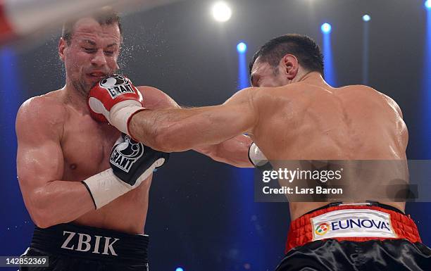 Sebastian Zbik of Germany is punshed by Felix Sturm of Germany during their WBA World Championship middleweight fight at Lanxess Arena on April 13,...