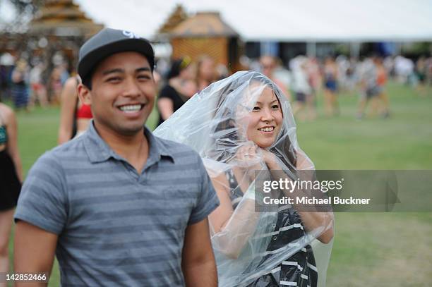 Coachella music fans Peter Phan Sokha Kim attend the 2012 Coachella Valley Music & Arts Festival held at The Empire Polo Field on April 13, 2012 in...
