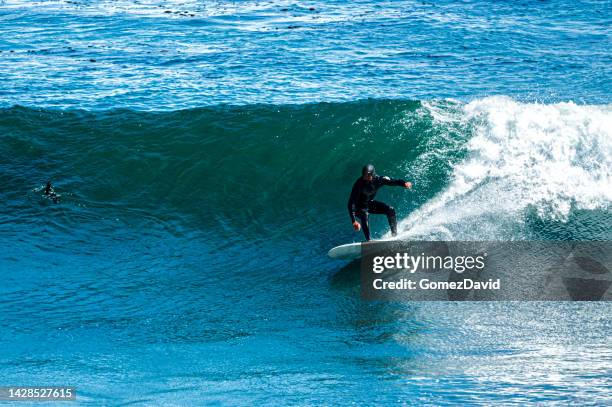 Topper Wave Riding 4,303 Riding A Wave Stock Photos, High-Res Pictures, and Images - Getty ...