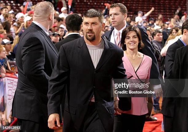 Red Sox catcher Jason Varitek and his wife leave the field following tonight's festivities for opening night of the movie "Fever Pitch" at Fenway...