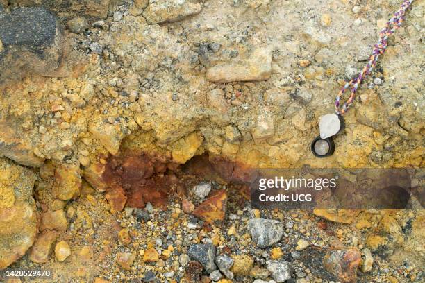 Orpiment and Realgar both arsenic sulfide minerals. Kameni volcano, Santorini, Greece..
