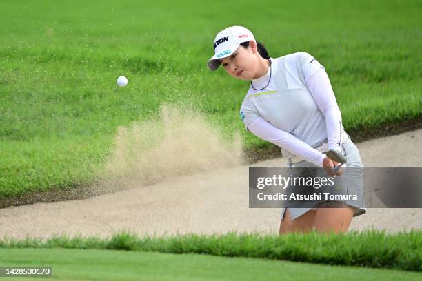 Sakura Koiwai of Japan hits out from a bunker on the 11th hole during the first round of the Japan Women's Open Golf Championship at Murasaki Country...