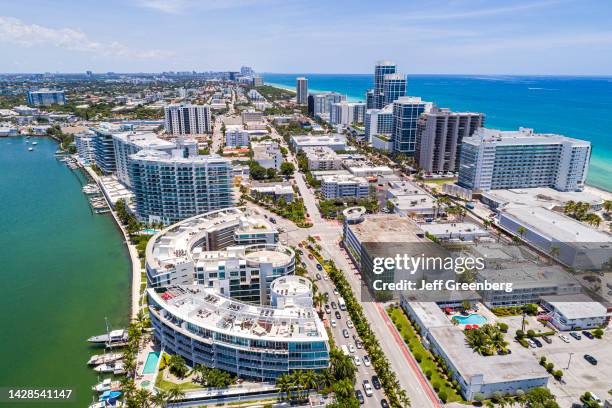 Miami Beach, Florida, aerial view, Indian Creek waterfront featuring high rise buildings and Peloro Apartments.